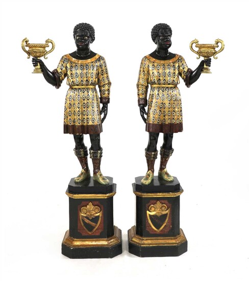 A pair of Venetian carved ebonised and polychrome painted blackamoors