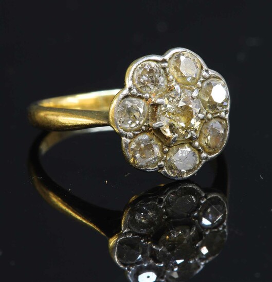 A gold diamond cluster ring