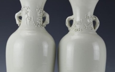 A Pair of Blanc-de-Chine Handled Plum Vases