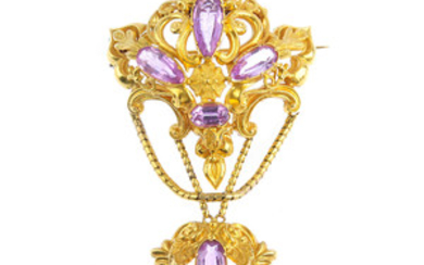 An early Victorian gold topaz brooch. View more details