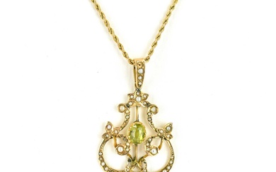 A 9ct gold Edwardian style pendant with centred bezel set...