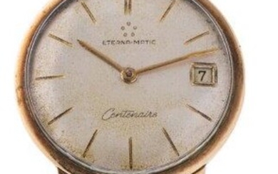 A 9ct gold gold 'Eterna-Matic Centenaire' wristwatch, by Eterna, the silvered dial with gilt baton markers, date aperture at three o'clock, signed Eterna-matic, Centenaire, (missing crown) snap on case back, c.1960, case width 34mm Please note that...