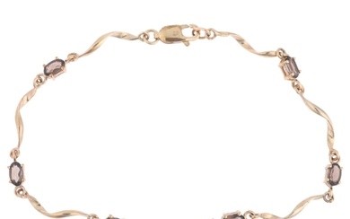 A 9ct gold smoky quartz tennis line bracelet, 18cm, 3.5g