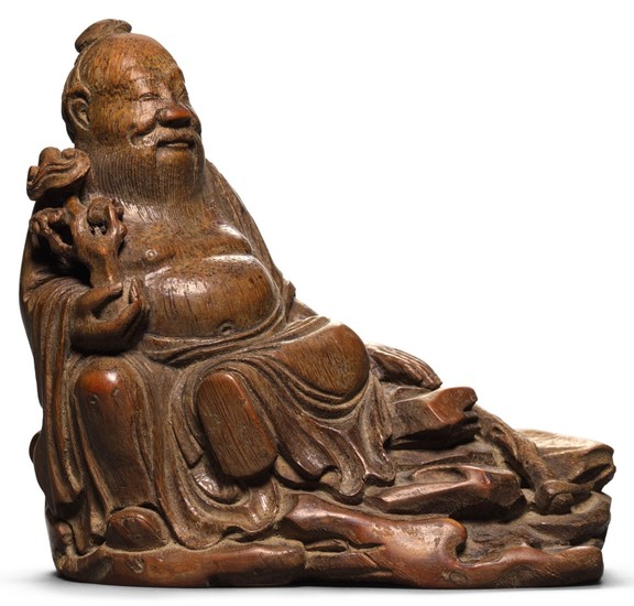 A CARVED BAMBOO FIGURE OF AN IMMORTAL 17TH CENTURY | 十七世紀 竹雕仙人坐像