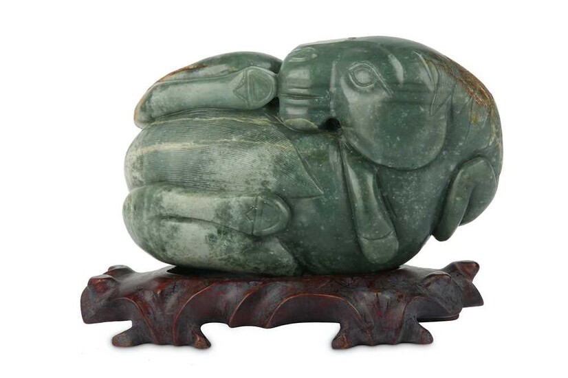 A CHINESE CELADON JADE CARVING OF A HORSE.