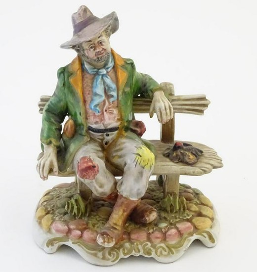 A Capodimonte figure modelled as a tramp wearing a hat