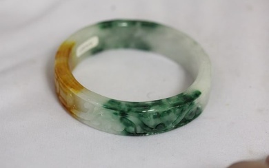 A Carved Jadeite Bangle Bracelet