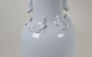 A Chinese blanc de chine porcelain vase with twin...