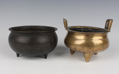 A Chinese brown patinated bronze tripod censer, Qing dynasty, of low-bellied circular form on three