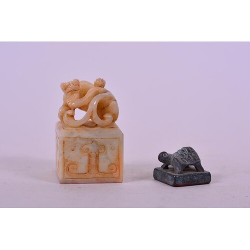 A Chinese carved hardstone seal with kylin decoration, toget...