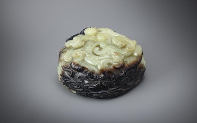 A Chinese celadon and black jade 'Dragon' paper weight
