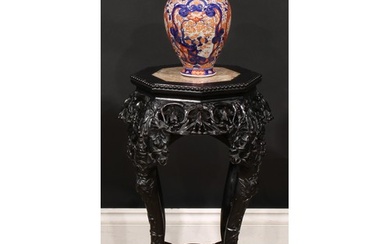A Chinese hardwood jardiniere stand, octagonal top with bead...