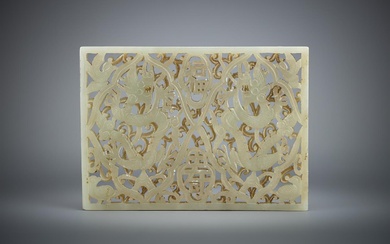 A Chinese pale celadon 'Dragon' openwork plaque