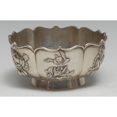 A Chinese silver lotus shaped pedestal bowl, applied with pa...