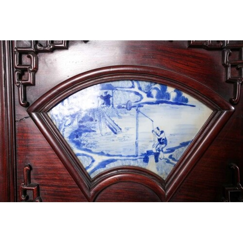 A Chinese six panel hongmu folding room divider with blue & ...