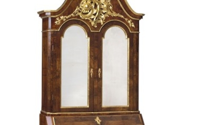A Danish Rococo walnut bureau mirror cabinet. Mid-18th century. H. 283 cm. W. 134 cm. D. 65 cm.