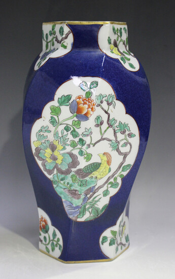 A French porcelain Chinese famille verte style vase, early 20th century, of hexagonal twisted balust