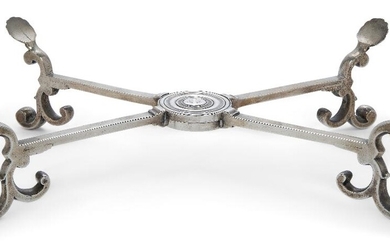 A George II silver dish cross, London, 1747, William Grundy, the legs will scroll terminals and four shell feet, the central section engraved with crest, approx. 30cm dia., approx. weight 18.8oz Provenance: Lot 269, Christie's New York, Silver, 24...