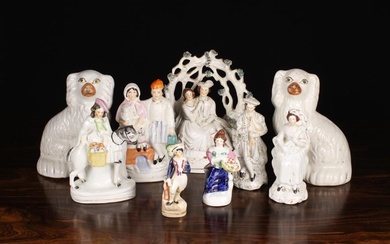A Group of Victorian Staffordshire Figures: A couple sat under bower encrusted with clumps of foliag