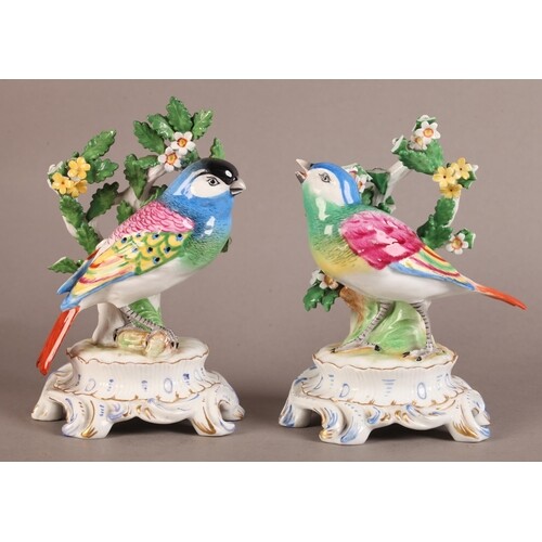 A PAIR OF CONTINENTAL PORCELAIN FIGURES modelled as a pair o...