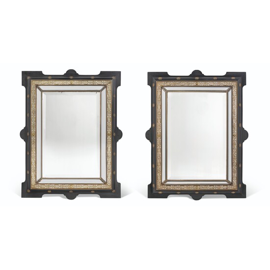 A PAIR OF FRENCH GILT-METAL-MOUNTED EBONISED WALL MIRRORS