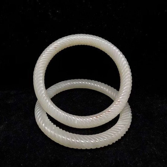 A Pair Of Carved White Jade Bangle