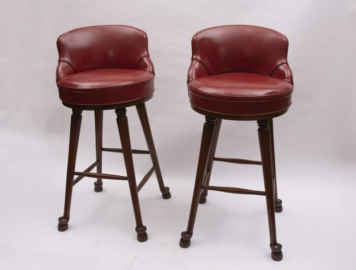 A Pair of Red Leather Upholstered Swivel Bar Stools