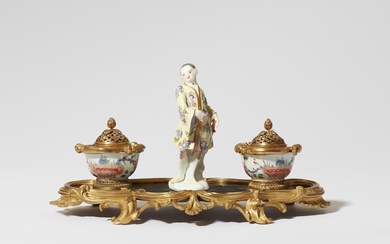 A Parisian ormolu writing set with a Meissen porcelain figure
