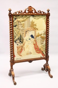 A VICTORIAN ROSEWOOD FRAMED FIRESCREEN, with woolwork