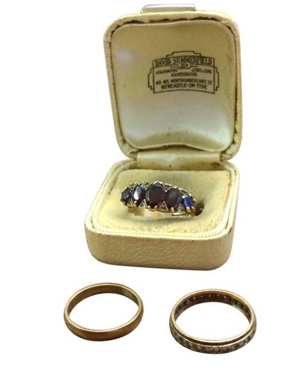 A Victorian 9ct gold ring set with graduated scrolled...
