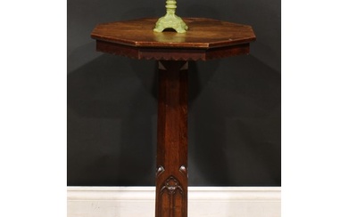 A Victorian Gothic Revival oak pedestal centre table, octago...