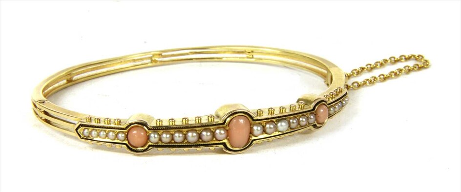 A Victorian gold coral and split pearl hinged bangle