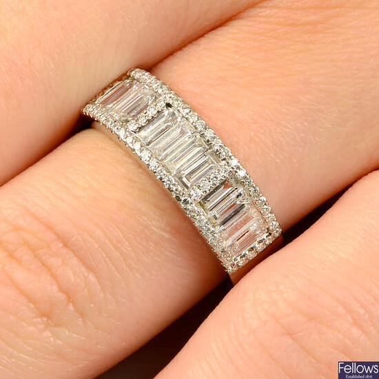 A brilliant and baguette-cut diamond half eternity ring.