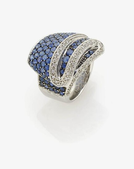 A brilliant cut diamond and sapphire ring