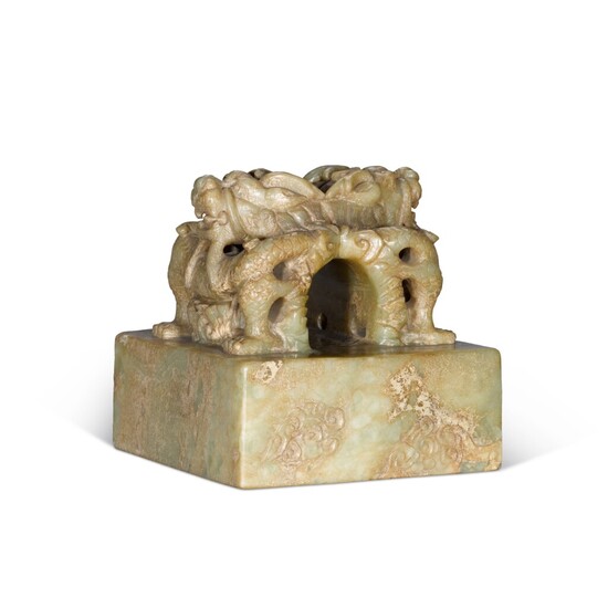 A celadon jade seal Ming Dynasty or later | 明或以後 青玉交龍鈕方印