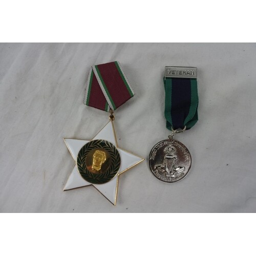 A collection of 2 medals to include Russian piece & Royal Ir...