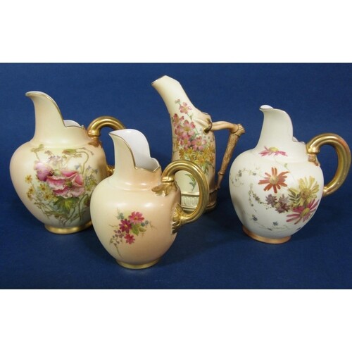 A collection of four Royal Worcester blush ivory jugs of var...