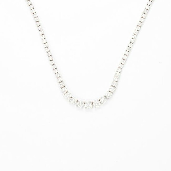 A diamond and fourteen karat white gold necklace
