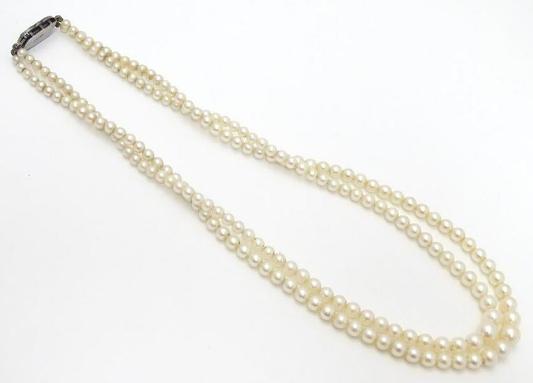 A double strand pearl necklace / choker of graduated