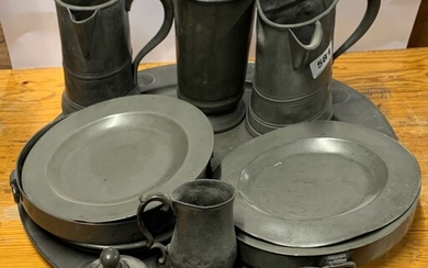A group of five early pewter tankards, together with a large pewter tray, plate warmers etc, tray Dia. 51cm.