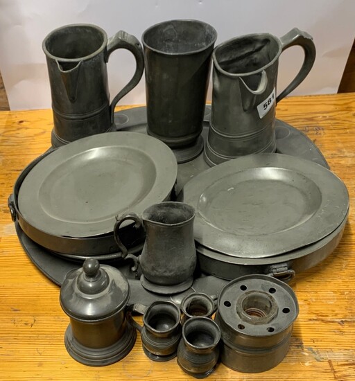 A group of five early pewter tankards, together with a large pewter tray, plate warmers etc, tray Dia. 51cm.