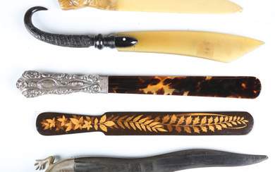 A late 19th century horn paperknife with brass lizard head handle, length 26cm, together with a silv