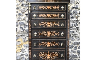 A late Victorian ebonised wellington chest of seven graduati...