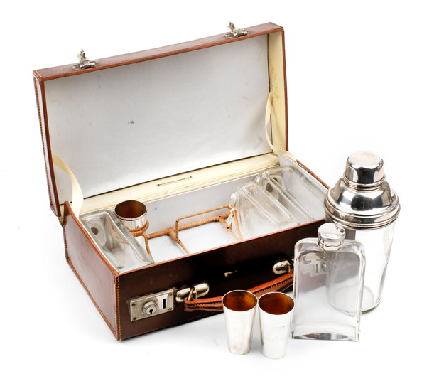 A leather-cased travelling drinks set for four persons, circa 1909