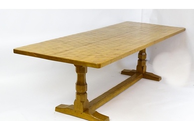 A mid 20thC Robert 'Mouseman' Thompson dining table. The 8ft...
