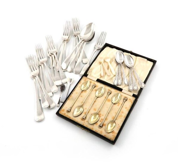 A mixed lot of silver flatware, comprising: fourteen Old English pattern dessert forks, various dates and makers, including The Goldsmiths and Silversmiths Company, London 1935, plus a table fork and three dessert forks, a set of six teaspoons, a...