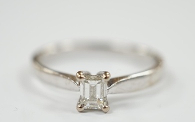 A modern 18ct white gold and solitaire emerald cut diamond s...