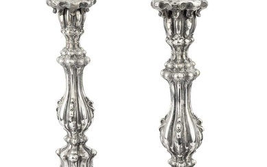 A pair of 19th century German silver candlesticks, of knopped...