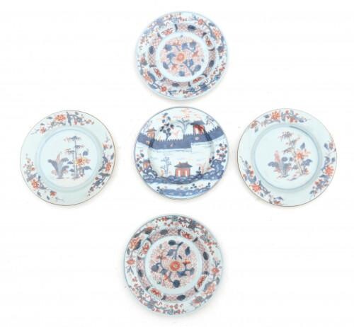 A pair of Chinese porcelain Imari plates with tobacco leaf and bamboo decoration, a pair of plates with flower decoration and a plate with city wall and pavillion decoration