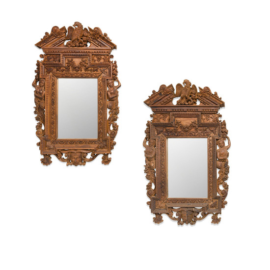 A pair of French Renaissance Style Carved Oak Mirrors